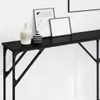 A close-up view of a black console table with decorative items on top. Náhled obrázku produktu