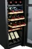 A close-up view of a wine cooler with several bottles of wine inside. Produktbild-Vorschau