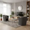 A modern living room with a dark gray armchair, a coffee table, a TV, and a bookshelf. Produktbild-Vorschau