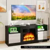 A TV stand with a fireplace insert and LED lighting, displaying a rainbow on the TV screen. Podgląd zdjęcia produktu