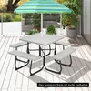 A picnic table set with benches and a colorful umbrella on a wooden deck. Produktbild-Vorschau