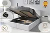 A bed with its storage compartment open, showing the slatted frame and the interior space. Various feature callouts are present. Produktbild-Vorschau