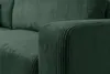 A close-up view of a green corduroy sofa armrest and cushion. Voir les images du produit