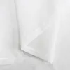 A close-up view of white fabric, showing folds and seams. Produktbild-Vorschau