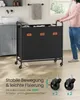 A person is pushing a black laundry cart with three compartments in a bathroom. Produktbild-Vorschau