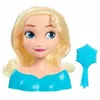 A doll's styling head with blonde hair and a blue dress, along with a blue comb. Voir les images du produit