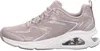A side view of a beige Skechers sneaker with glitter accents and a white sole. Voir les images du produit
