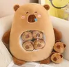 A plush toy bear with smaller bear plushies inside its belly, sitting on a couch. Anteprima dell’immagine prodotto