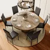 A round dining table set with chairs in a well-lit room. Náhľad obrázku produktu