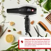 A black Solis hair dryer is displayed on a white surface surrounded by natural elements like leaves, lemon slices, and stones, along with hair styling tools like scissors and a comb. Anteprima dell’immagine prodotto