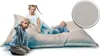 Three children are playing on a large beanbag chair. Produktbild-Vorschau