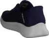 A close-up, rear-side view of a blue Skechers shoe with a white sole. Voir les images du produit