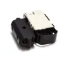 A close-up studio shot of a washing machine door lock mechanism, with a black outer casing and a white inner component, against a white background. Produktbild-Vorschau