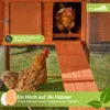 Two chickens are shown in and around a wooden chicken coop with a ramp. Produktbild-Vorschau