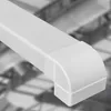 A close-up of a white plastic cable conduit corner piece, with a blurred industrial background. Anteprima dell’immagine prodotto