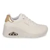 A white SKECHERS UNO WEDGE-HI STEPS Sneaker for women is shown from the side against a white background. Voir les images du produit