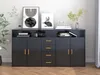 A modern black sideboard with gold handles is displayed in a room setting with artwork and decorative items on top. Voir les images du produit