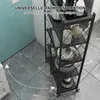 A black five-tier kitchen shelf unit with various kitchenware items on its shelves, placed on a marble-tiled floor next to a blue tiled wall. Produktbild-Vorschau