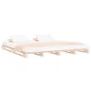 A wooden pallet bed frame with white bedding and a peach throw blanket. Produktbild-Vorschau