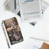 A phone case with a cat and tiger design is placed on a white surface next to a tablet and newspapers. Produktbild-Vorschau