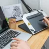 A person's hands are using a drawing tablet connected to a laptop, with colored pencils and the product box in the background. Náhľad obrázku produktu
