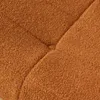 A close-up view of a textured, orange fabric, likely a cushion or upholstery. Voir les images du produit