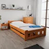 A bedroom scene with a wooden bed and a dresser. Produktbild-Vorschau