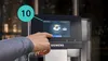 A hand is shown interacting with the touchscreen of a Siemens coffee machine. Produktbild-Vorschau
