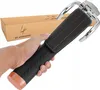 A hand holding a steering wheel lock with a box in the background. Náhľad obrázku produktu