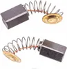 Two carbon brushes with springs and end caps, presented against a white background. Podgląd zdjęcia produktu