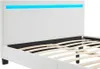 A close-up view of a modern white bed frame with a blue LED light strip at the headboard. Náhled obrázku produktu