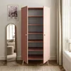 A pink wardrobe with open doors, revealing shelves, in a room with a mirror and a painting on the wall. Produktbild-Vorschau