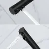 Close-up shots of a black faucet with water flowing from it. Produktbild-Vorschau