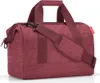 A studio shot of a maroon duffel bag. Anteprima dell’immagine prodotto