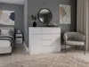 A bedroom scene with a dresser, bed, chair, and artwork. Anteprima dell’immagine prodotto