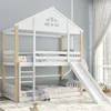 A white and wood bunk bed with a slide and a house-like roof structure, set in a child's bedroom. Produktbild-Vorschau