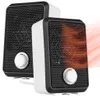 Two compact electric heaters are shown side-by-side against a white background. The heater on the right has a warm orange glow emanating from its grille, indicating it is in operation. Produktbild-Vorschau