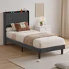 A bedroom scene with a bed and nightstand. Produktbild-Vorschau