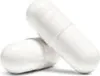 Two white capsules are shown against a white background. Produktbild-Vorschau