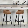 Two brown bar stools with black legs are placed in front of a kitchen counter. Produktbild-Vorschau