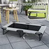 An elevated dog bed is shown on a patio, with inset images highlighting its features. Produktbild-Vorschau