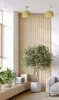 A modern living room with a pendant light and a potted plant. Produktbild-Vorschau
