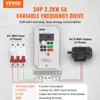 Diagram showing a variable frequency drive connected to a circuit breaker and a motor, with labels and a table explaining terminal functions. Náhled obrázku produktu