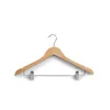 A wooden hanger with clips against a white background. Produktbild-Vorschau