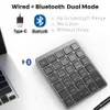 A close-up shot of a wireless numeric keypad next to a laptop, with marketing text and icons. Produktbild-Vorschau