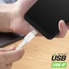 A hand is plugging a white USB-C cable into a black smartphone. Voir les images du produit