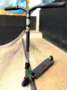 A freestyle scooter is shown in a skate park. Voir les images du produit