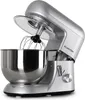 A silver stand mixer is shown from a side-angle with the mixing bowl and whisk attachment visible. Produktbild-Vorschau
