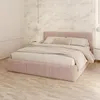 A bedroom scene with a pink upholstered bed. Produktbild-Vorschau