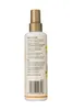 The back of a white spray bottle with a gold cap, showing product information and a barcode. Voir les images du produit